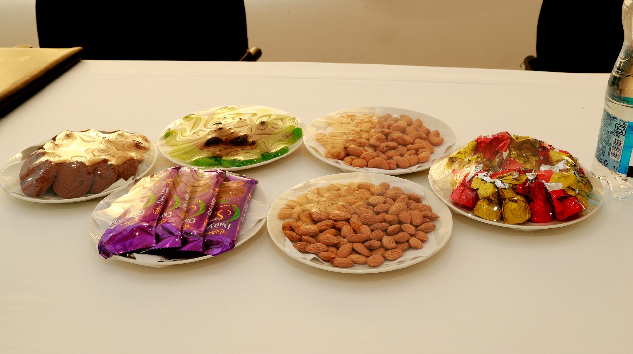 VIP guest refreshment platter with almonds, cashews, and sweets